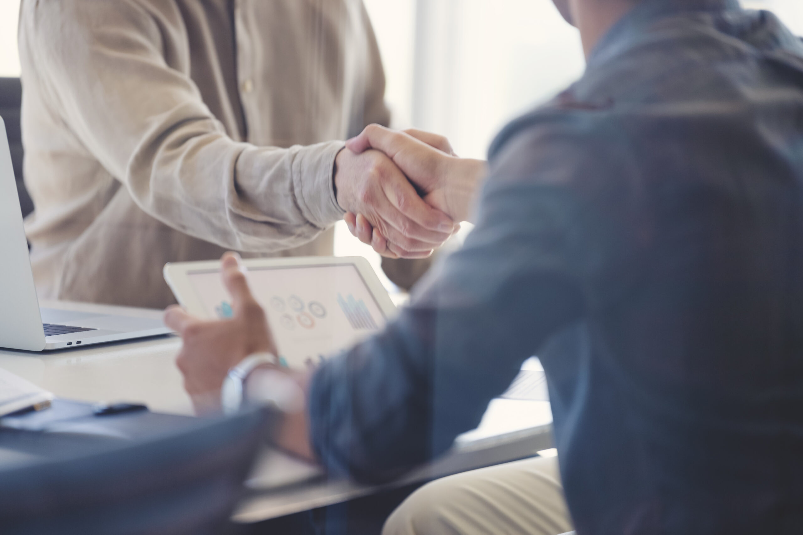 Close up of two people shaking hands