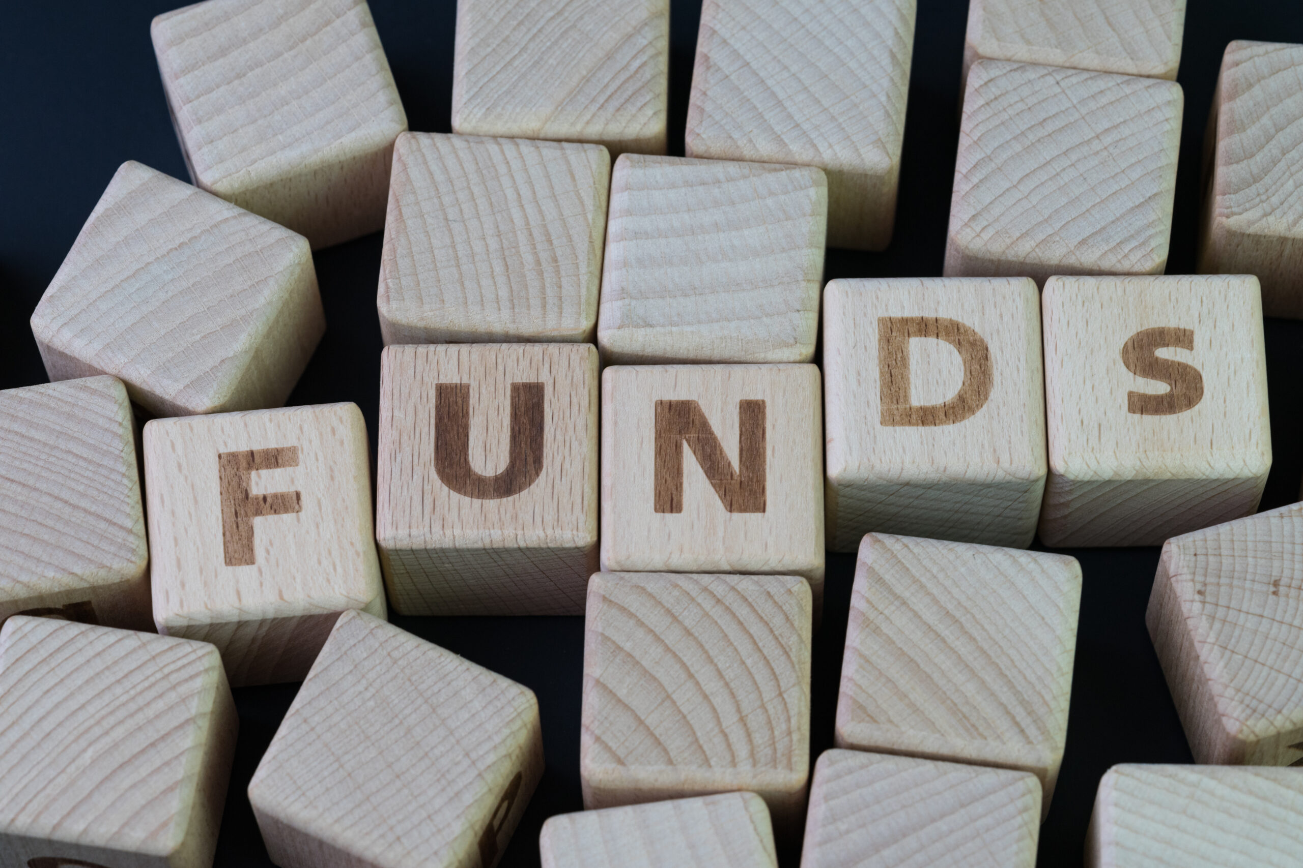 Wooden blocks spelling out the word funds