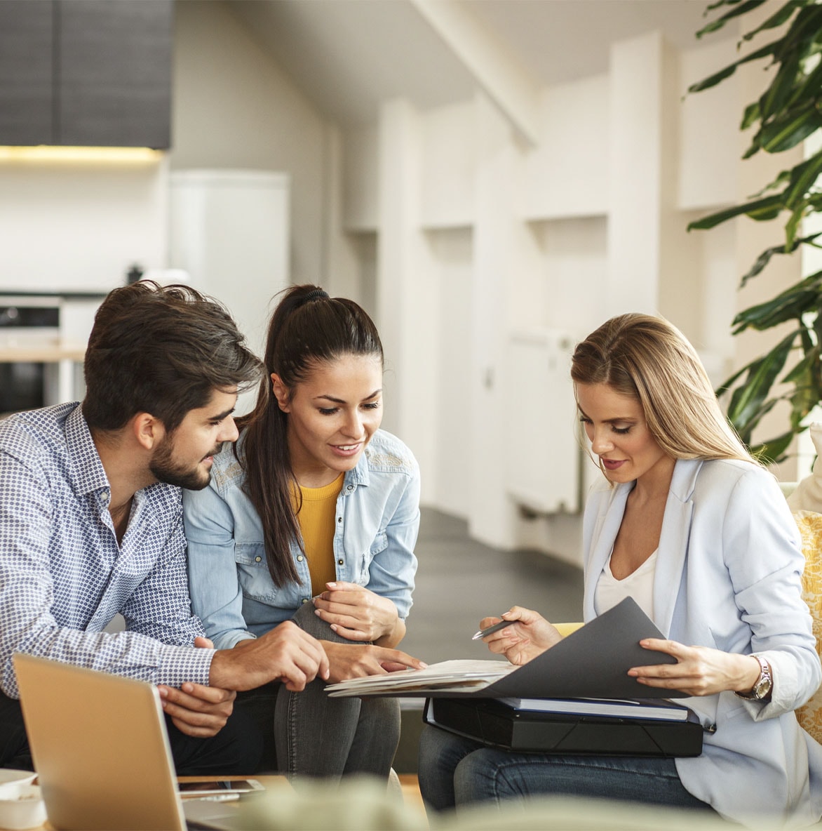 Financial advisor meets with clients