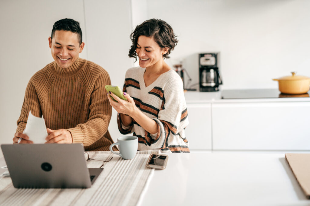 Couple at home planning family budget