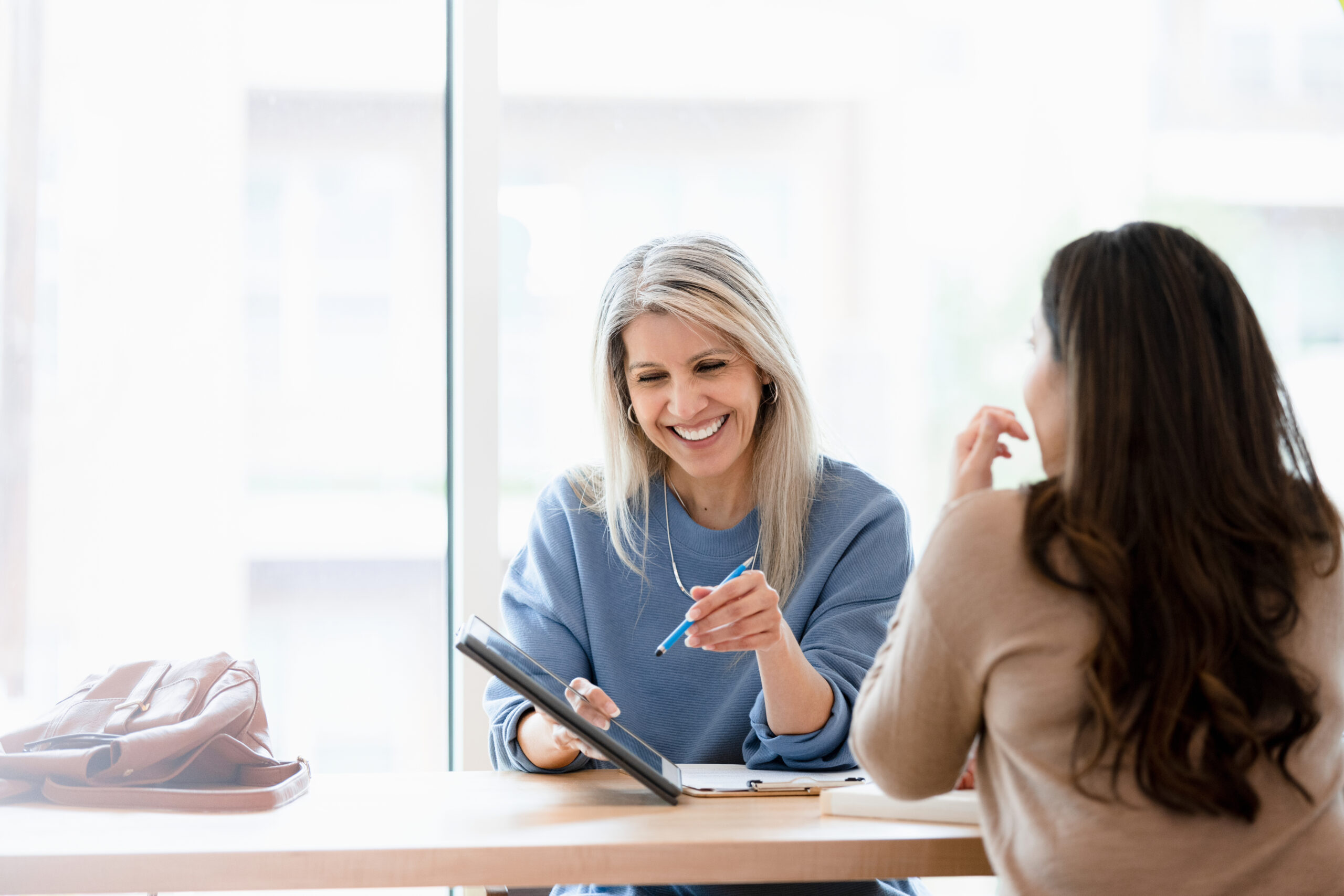 A financial advisor and their client during a meeting