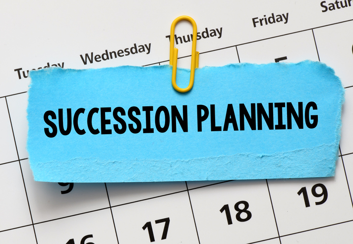 Succession planning words on a blue card in the calendar.